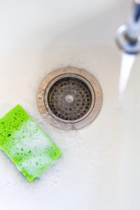 Soapy Green Sponge in White Sink, Copy Space